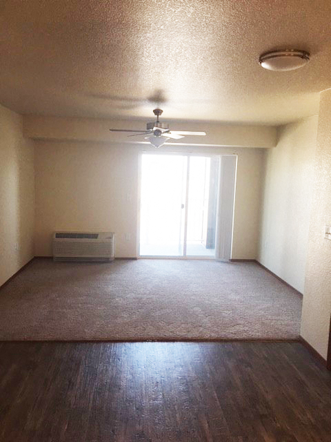 Image of open space with AC unit and fan